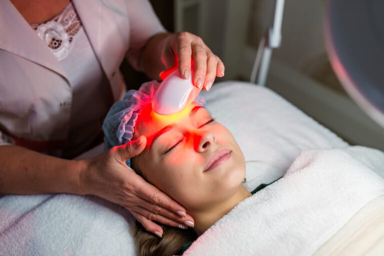 Skin Care. Young Woman Receiving Facial Beauty Treatment, Removing Pigmentation At Cosmetic Clinic. Intense Pulsed Light Therapy. IPL. Rejuvenation, Photo Facial Therapy. Anti-aging Procedures